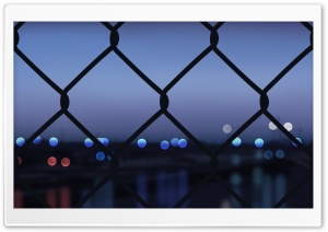 Chain Link Fence with City Bokeh 4K UHD Wallpaper for Widescreen and UltraWide Desktop, UltraHD TV, Smartphone, Tablet