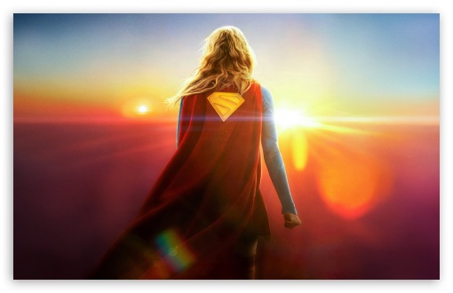 Supergirl Standing in Front of Twin Suns Sunset 2026 Movie UltraHD Wallpaper for UHD 16:9 ; HD 16:9 ; UltraWide 21:9 24:10 32:9 32:10 ; Widescreen 16:10 ; Tablet 1:1 ; Mobile 9:16 9:19.5 9:20 ; Dual 16:10 16:9 ;